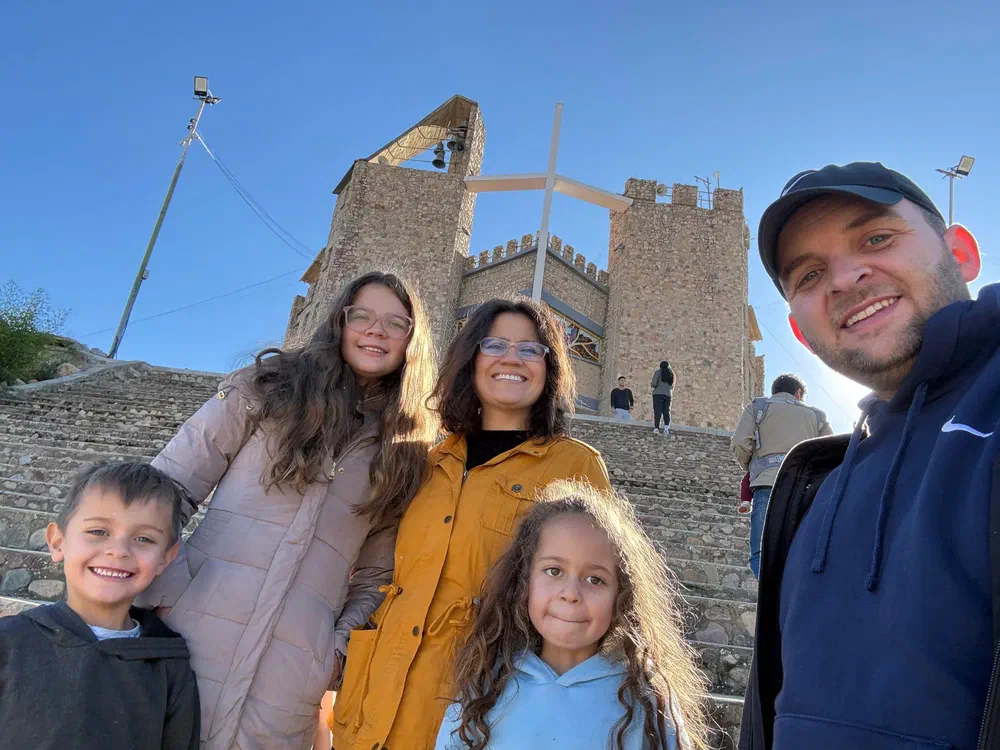 My family posing on the stone steps below the Iglesia de Melga