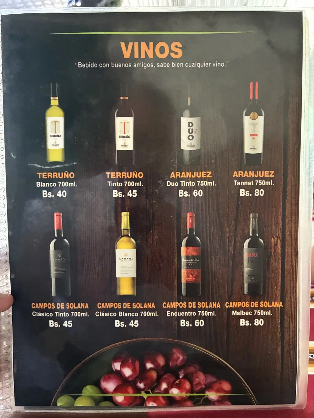 Menu page headed Vinos, showing eight Bolivian wine bottles with prices